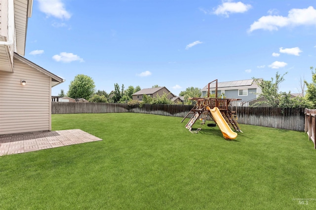 5291 N Midnight Haze Way, Meridian, ID 83646 - fenced backyard featuring a playground and a patio