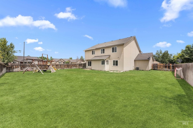 5291 N Midnight Haze Way, Meridian, ID 83646 - rear view of house with a playground and a fenced backyard