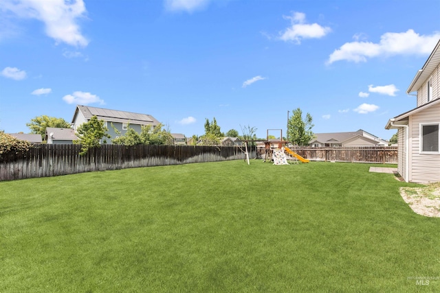 5291 N Midnight Haze Way, Meridian, ID 83646 - fenced backyard with a playground