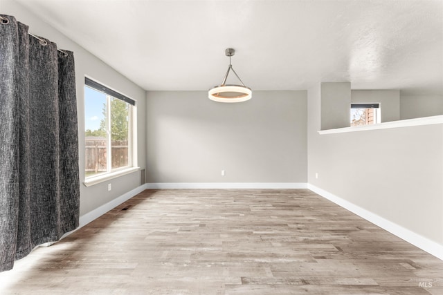 5291 N Midnight Haze Way, Meridian, ID 83646 - unfurnished room with light wood finished floors and baseboards