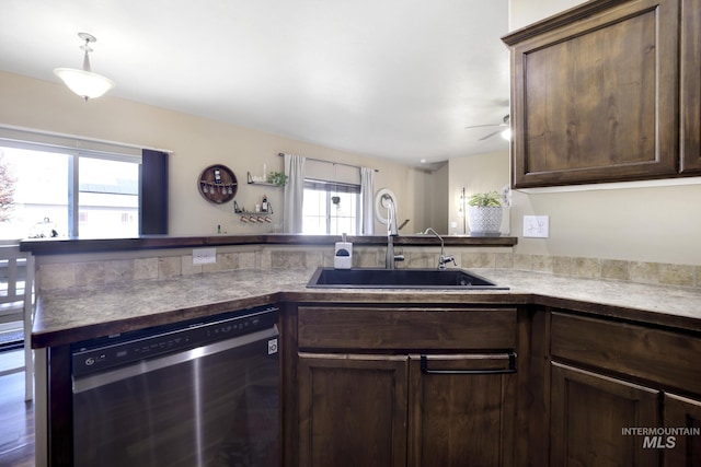 812 Kelli Ln, Filer, ID 83328 - kitchen with ceiling fan, dishwashing machine, dark brown cabinetry, a peninsula, and a sink