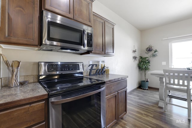 812 Kelli Ln, Filer, ID 83328 - kitchen featuring baseboards, dark wood-style floors, dark brown cabinets, and stainless steel appliances