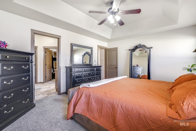 812 Kelli Ln, Filer, ID 83328 - bedroom with a raised ceiling, light carpet, a ceiling fan, and a spacious closet