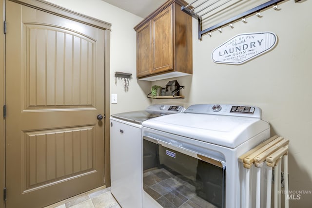 812 Kelli Ln, Filer, ID 83328 - laundry room featuring cabinet space and washer and clothes dryer