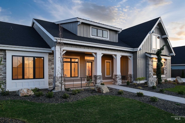 view of front of home featuring a yard and a porch