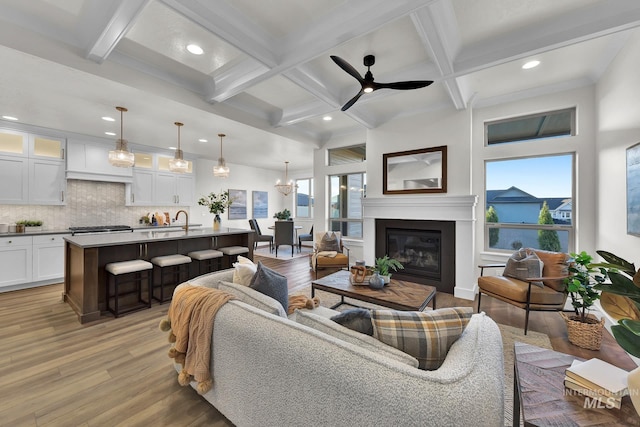 2477 E Galleon Ln, Meridian, ID 83642 - living area with light wood-style floors, recessed lighting, ceiling fan, beamed ceiling, and coffered ceiling