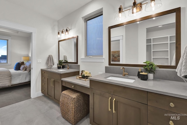 2477 E Galleon Ln, Meridian, ID 83642 - ensuite bathroom with two vanities and tile patterned floors