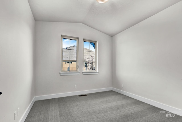 2477 E Galleon Ln, Meridian, ID 83642 - carpeted empty room featuring vaulted ceiling and baseboards