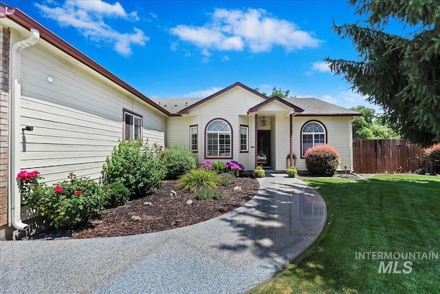 2668 N Morello, Meridian, ID 83646 - ranch-style home with a front yard and fence
