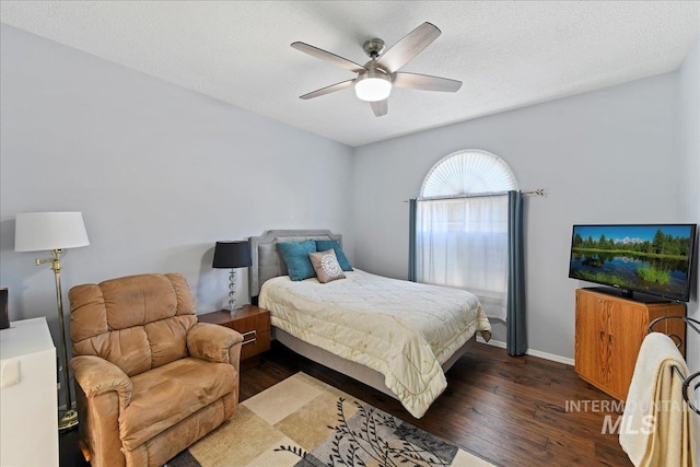 2668 N Morello, Meridian, ID 83646 - bedroom with a textured ceiling, wood-type flooring, a ceiling fan, and baseboards