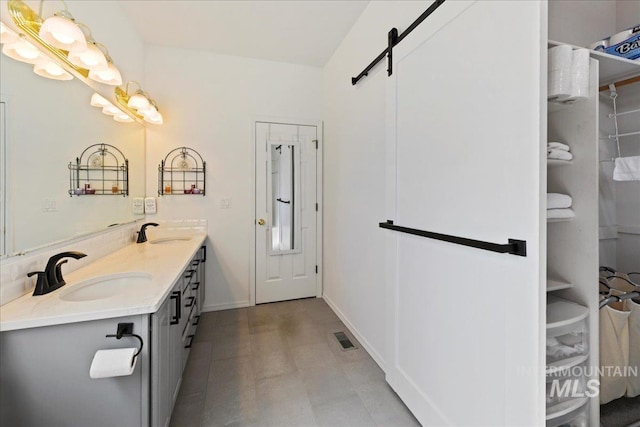 2668 N Morello, Meridian, ID 83646 - bathroom featuring tile patterned floors, double vanity, visible vents, and a sink