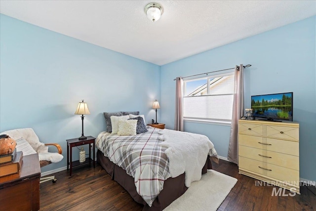2668 N Morello, Meridian, ID 83646 - bedroom with dark wood-type flooring and baseboards