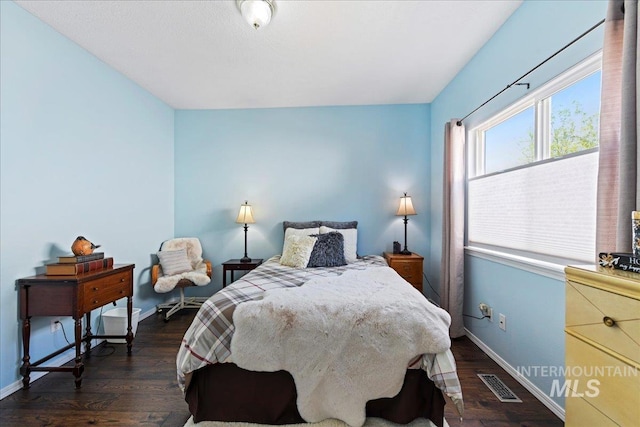 2668 N Morello, Meridian, ID 83646 - bedroom with baseboards, dark wood finished floors, and visible vents