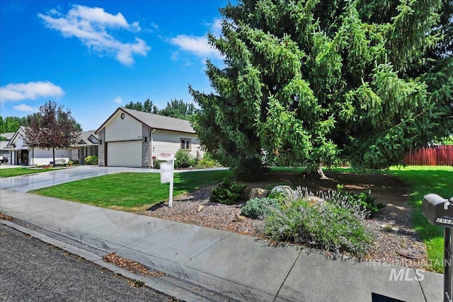 2668 N Morello, Meridian, ID 83646 - view of front facade with a front lawn, fence, a garage, and concrete driveway