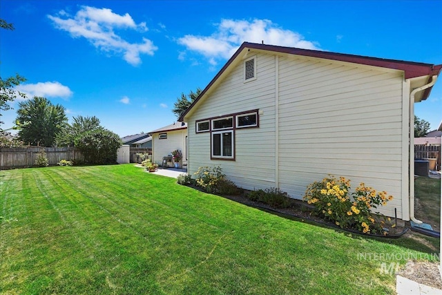 2668 N Morello, Meridian, ID 83646 - rear view of house featuring a patio, central air condition unit, a fenced backyard, and a lawn