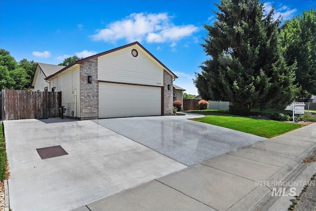 2668 N Morello, Meridian, ID 83646 - view of home's exterior featuring a yard, brick siding, driveway, and fence