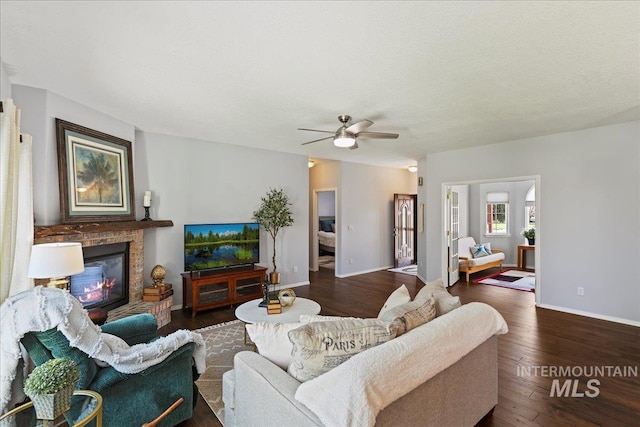 2668 N Morello, Meridian, ID 83646 - living room featuring wood finished floors, a fireplace, a ceiling fan, and baseboards