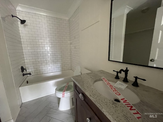 bathroom with shower / washtub combination, vanity, and toilet