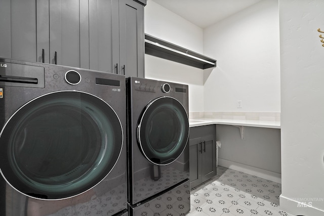 205 S Sunniva Ave, Kuna, ID 83634 - washroom featuring independent washer and dryer, cabinet space, and light floors