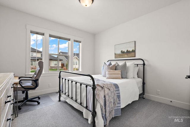 205 S Sunniva Ave, Kuna, ID 83634 - carpeted bedroom featuring baseboards and a desk