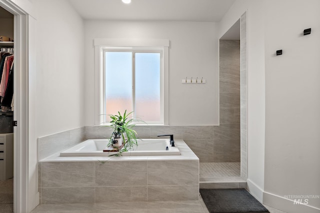 205 S Sunniva Ave, Kuna, ID 83634 - full bathroom featuring a garden tub and a spacious closet