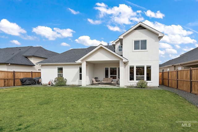 205 S Sunniva Ave, Kuna, ID 83634 - back of house featuring stucco siding, an outdoor hangout area, and a patio