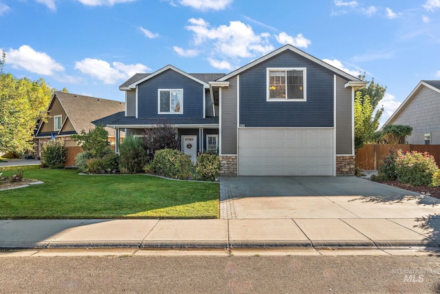 front of property with a garage and a front lawn