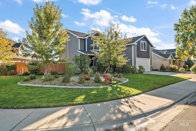 view of front of house featuring a garage and a front lawn