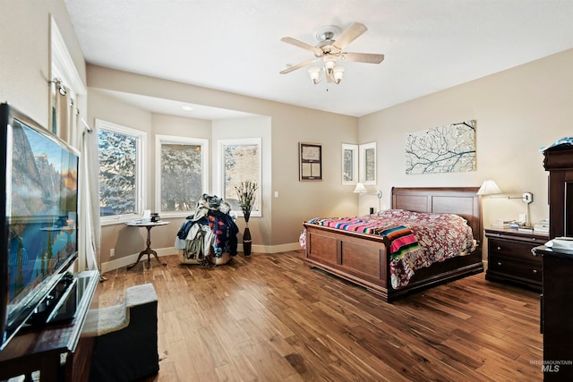 bedroom with wood-type flooring and ceiling fan