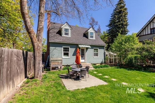 517 E C St, Moscow, ID 83843 - rear view of house featuring a patio and a shingled roof