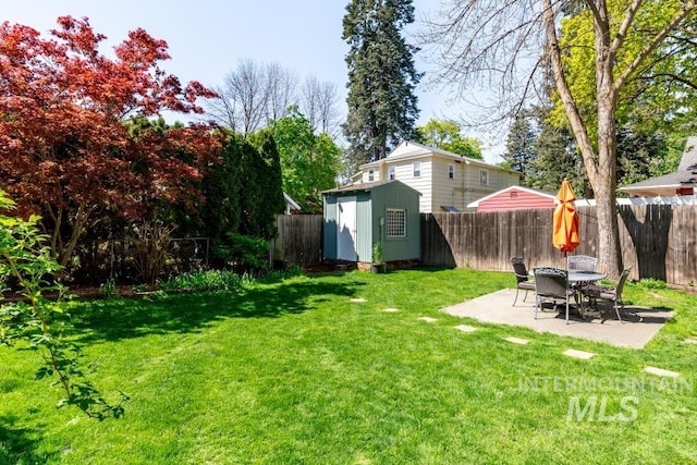 517 E C St, Moscow, ID 83843 - view of yard featuring a storage shed, a patio area, and an outdoor structure