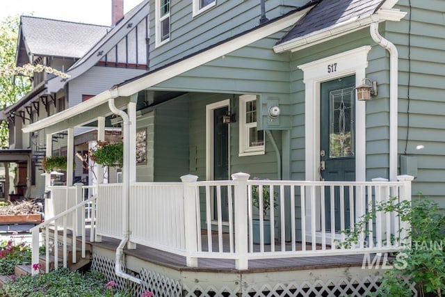 517 E C St, Moscow, ID 83843 - view of side of home featuring a porch and roof with shingles