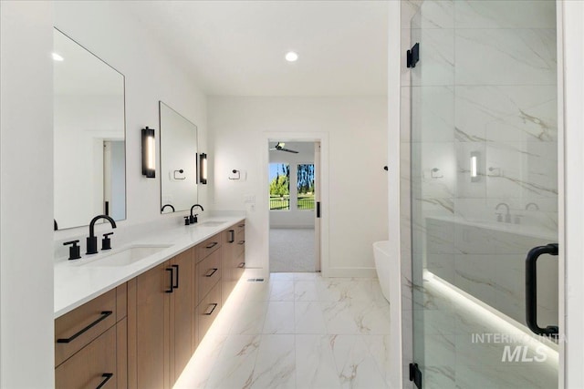 bathroom featuring vanity, an enclosed shower, and ceiling fan