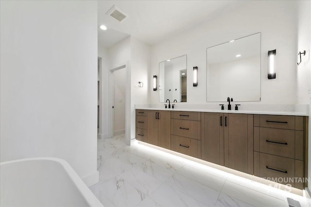 bathroom featuring vanity and a bathing tub