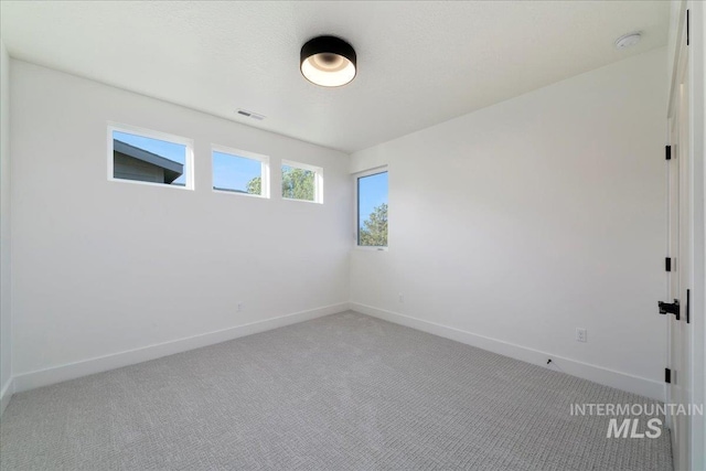 empty room featuring carpet floors