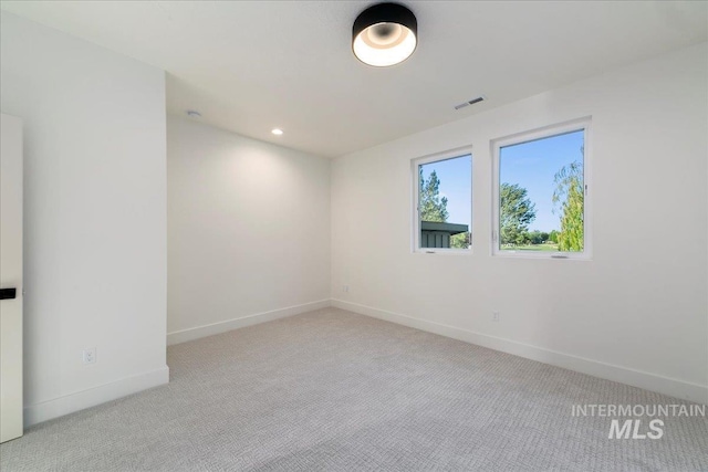 empty room featuring light colored carpet