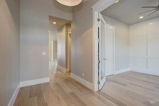 hallway with light wood-type flooring