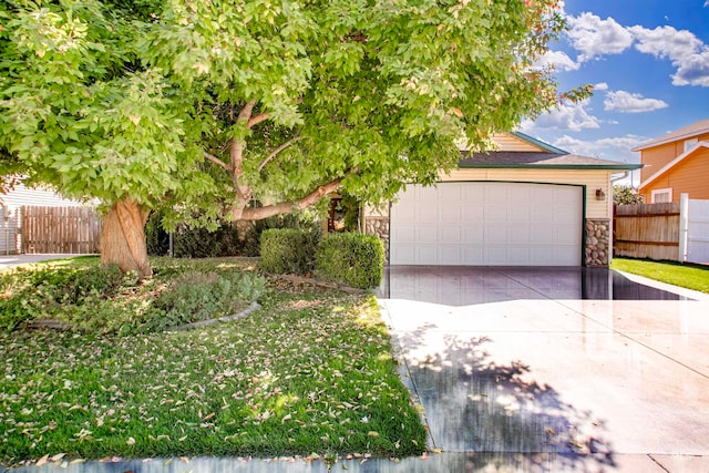 obstructed view of property with a garage