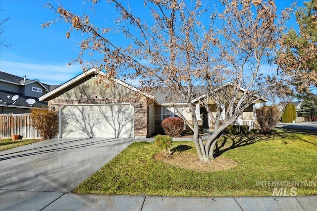 view of front of house with a front yard and a garage