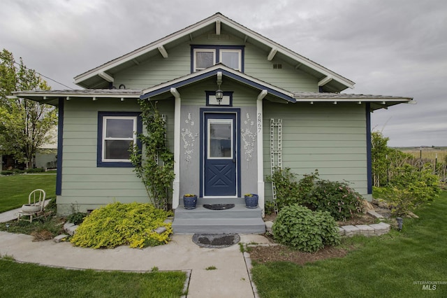 bungalow with a front yard