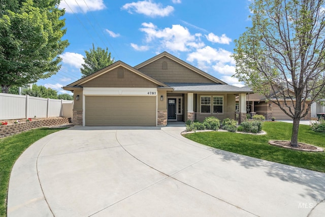 4787 N Stream Pl, Meridian, ID 83646 - craftsman inspired home featuring a garage, stone siding, concrete driveway, and a porch