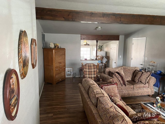 living room with beam ceiling and wood finished floors