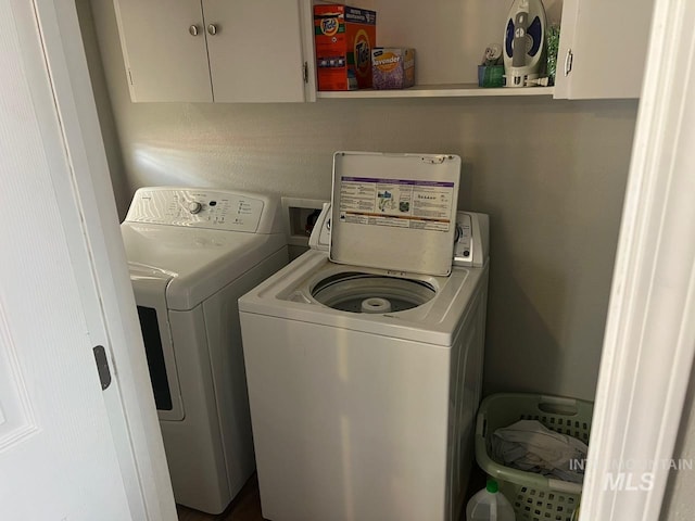 laundry area with cabinet space and washing machine and dryer