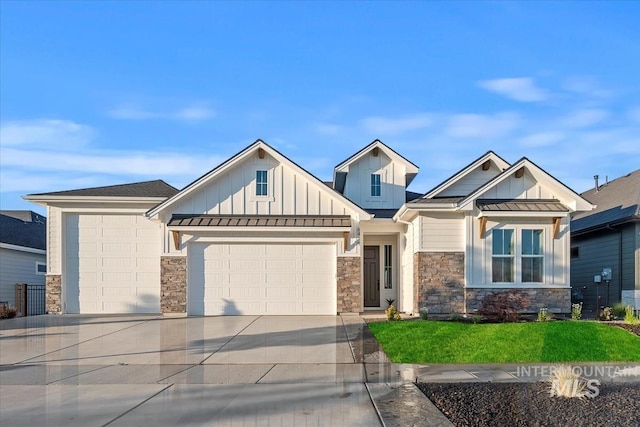 view of front facade with a garage and a front lawn