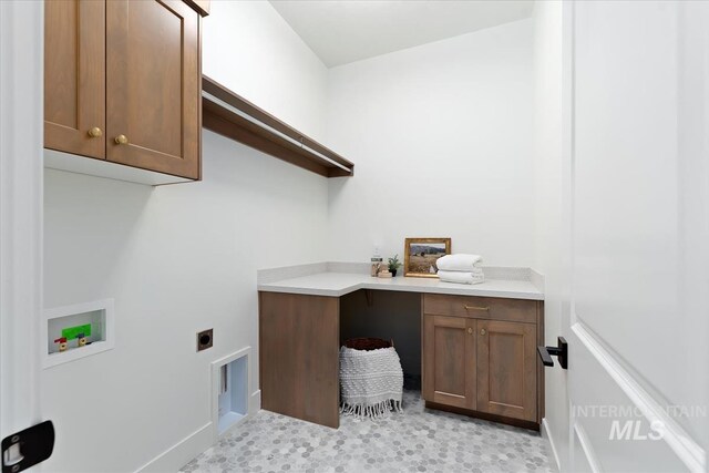 washroom with washer hookup, hookup for an electric dryer, and cabinets