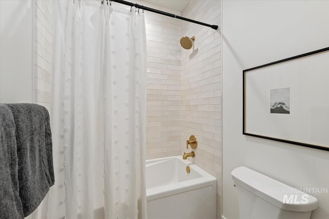 bathroom featuring toilet and shower / bath combo