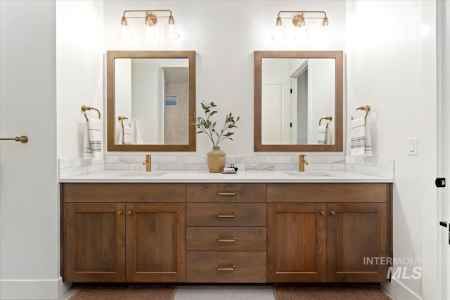 bathroom featuring a sink and double vanity
