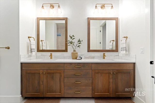 bathroom with tasteful backsplash and vanity