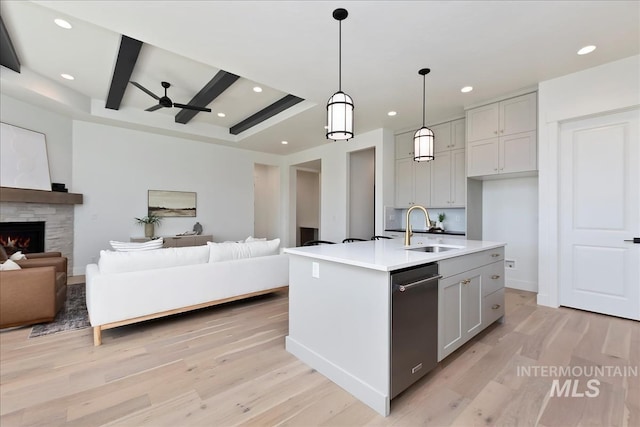 kitchen featuring open floor plan, a sink, recessed lighting, and ceiling fan