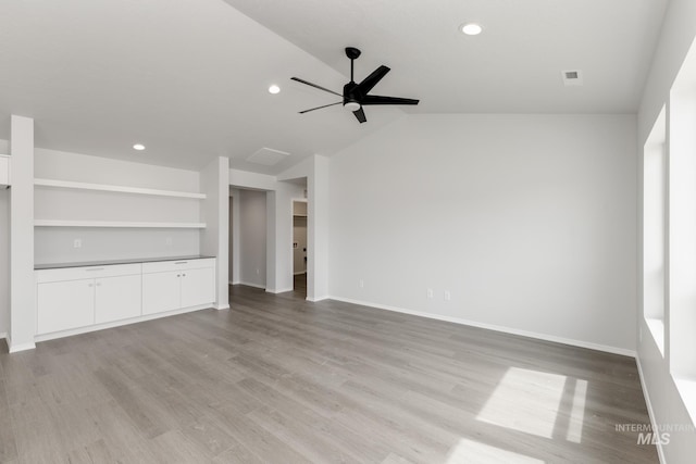 5754 W Stavros St, Meridian, ID 83646 - unfurnished living room featuring ceiling fan, light wood-type flooring, baseboards, recessed lighting, and lofted ceiling